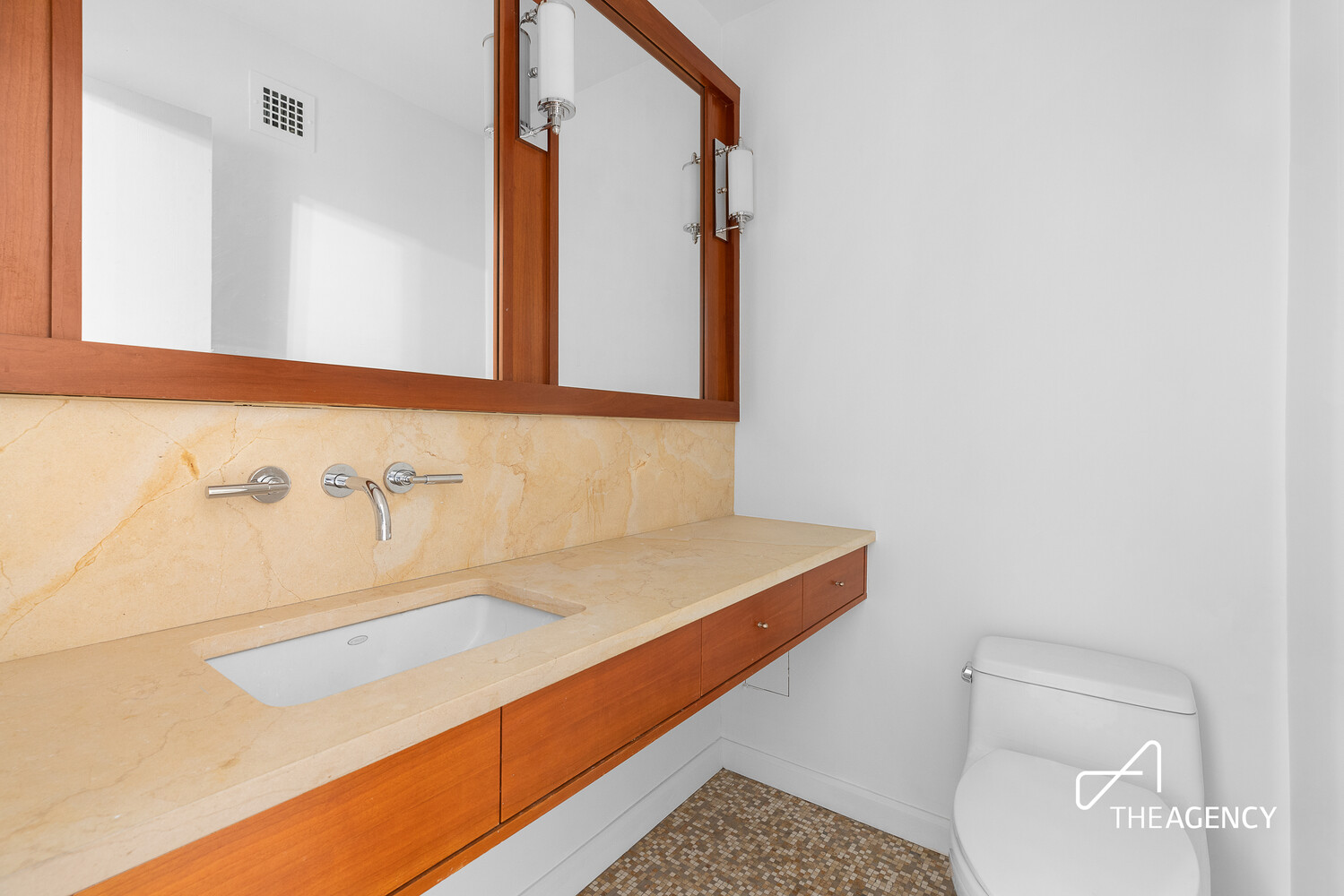 137 East 36th Street, Unit 3F Manhattan, NY 10016 - Photo 5 of 11 a bathroom with a sink and a mirror