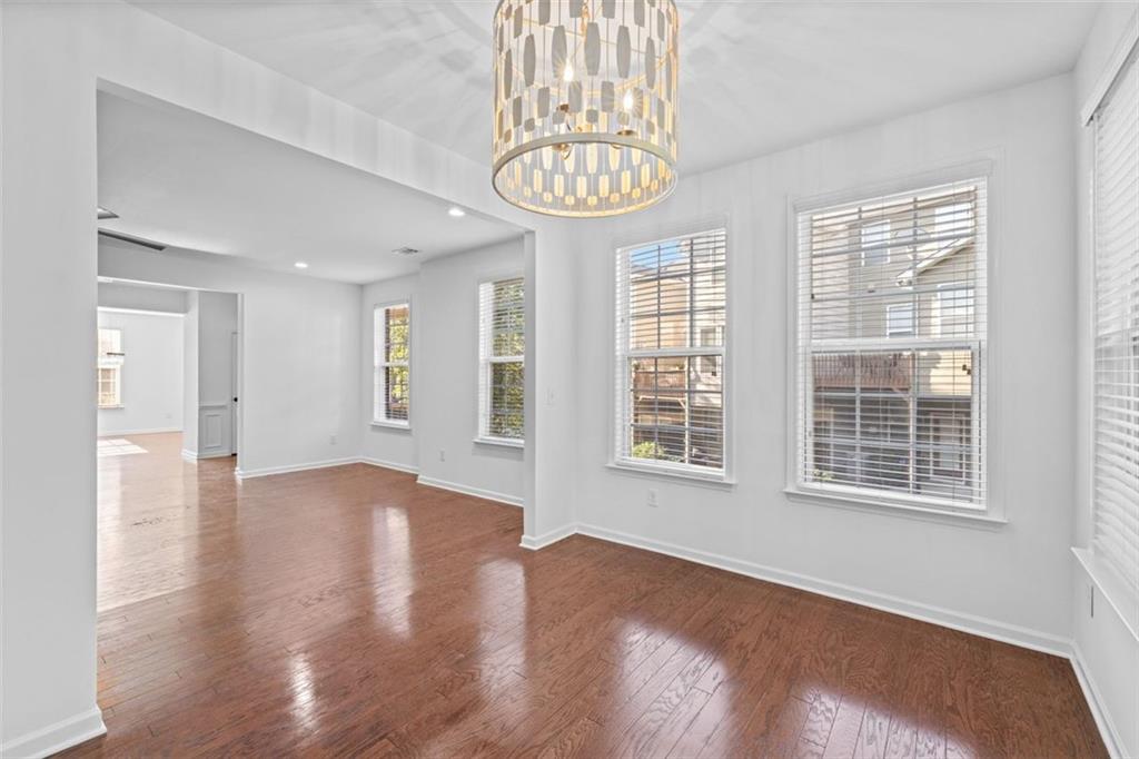 4228 Laurel Creek Court Southeast, Unit 6 Smyrna, GA 30080 - Photo 12 of 59 a view of an empty room with a window and wooden floor