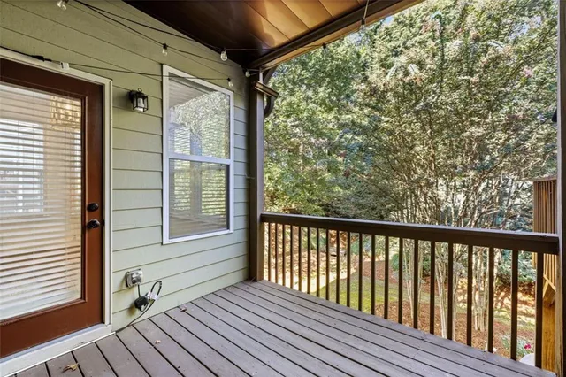 a kitchen with stainless steel appliances granite countertop a refrigerator a stove a sink and dishwasher with wooden cabinets