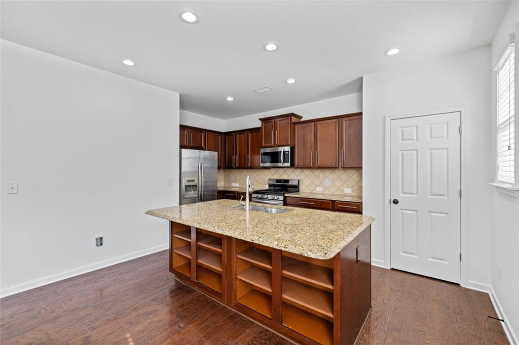 4228 Laurel Creek Court Southeast, Unit 6 Smyrna, GA 30080 - Photo 18 of 59 a kitchen with a stove a refrigerator and a sink