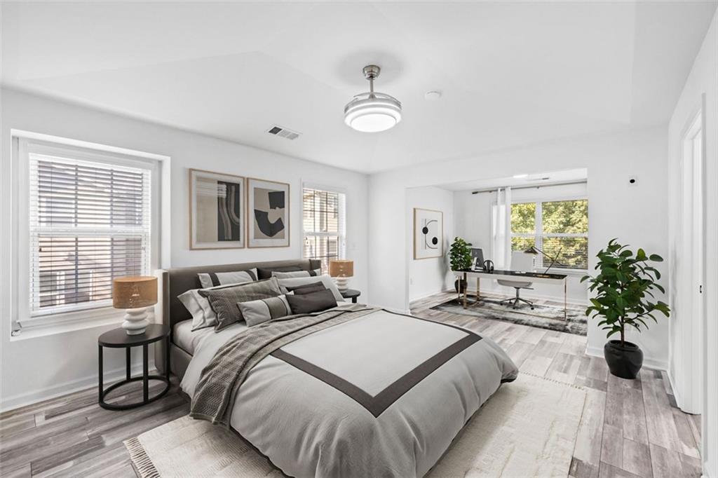 4228 Laurel Creek Court Southeast, Unit 6 Smyrna, GA 30080 - Photo 24 of 59 a bedroom with a large bed and a large window