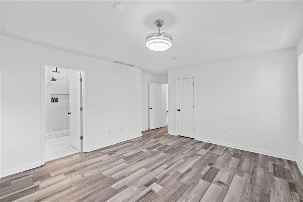 4228 Laurel Creek Court Southeast, Unit 6 Smyrna, GA 30080 - Photo 28 of 59 a view of empty room with wooden floor and window