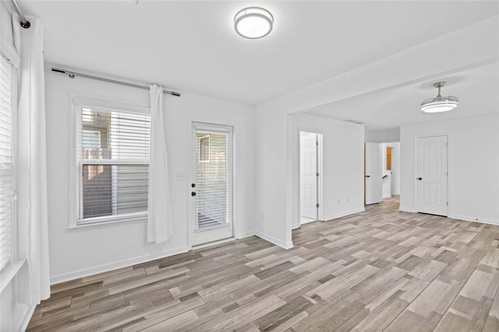 4228 Laurel Creek Court Southeast, Unit 6 Smyrna, GA 30080 - Photo 29 of 59 a view of empty room with wooden floor and fan