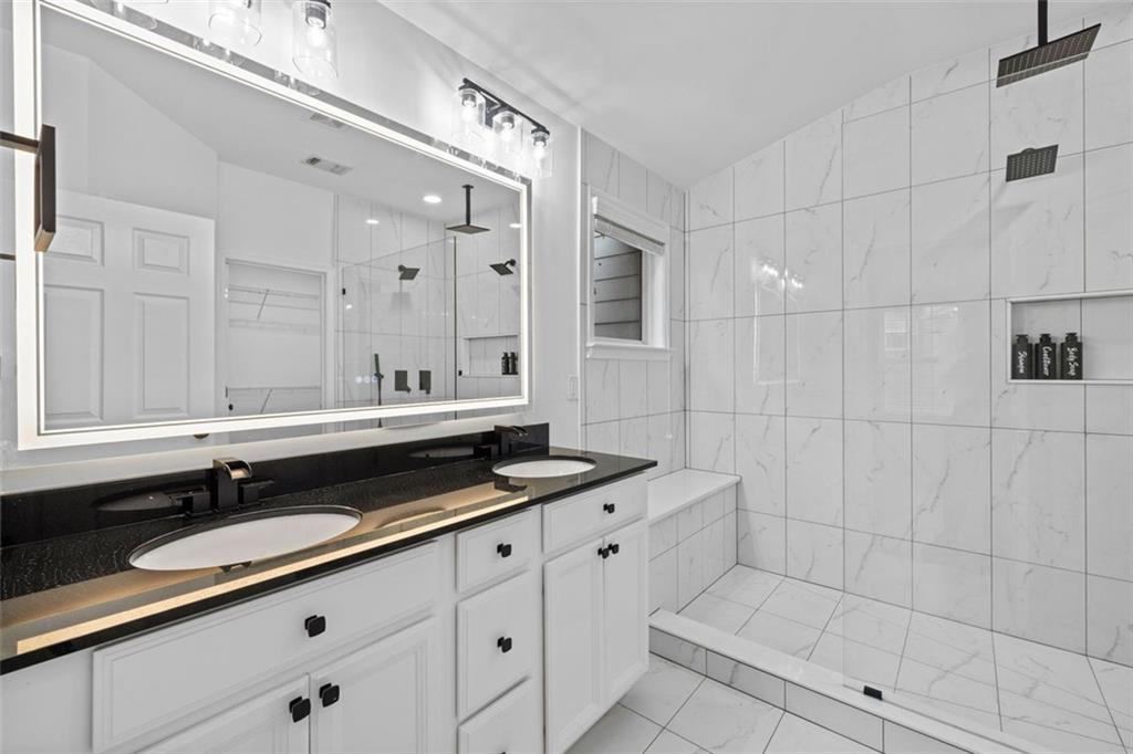 4228 Laurel Creek Court Southeast, Unit 6 Smyrna, GA 30080 - Photo 31 of 59 a bathroom with double sink and a mirror