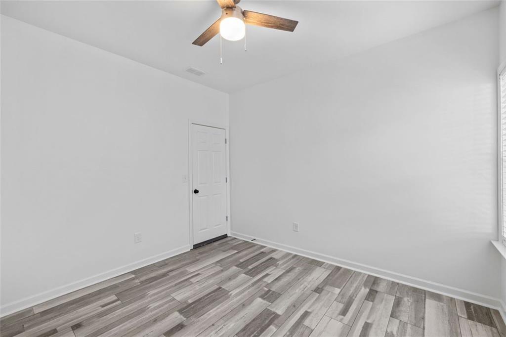 4228 Laurel Creek Court Southeast, Unit 6 Smyrna, GA 30080 - Photo 39 of 59 a view of a room with wooden floor and fan