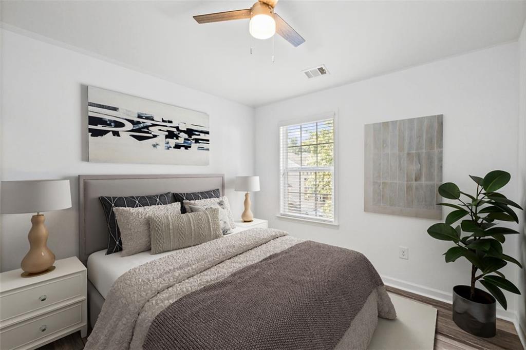 4228 Laurel Creek Court Southeast, Unit 6 Smyrna, GA 30080 - Photo 40 of 59 a bedroom with a bed and a chandelier