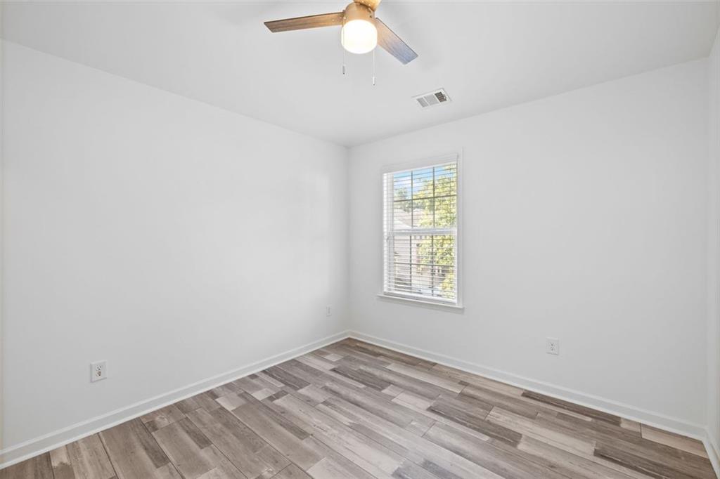 4228 Laurel Creek Court Southeast, Unit 6 Smyrna, GA 30080 - Photo 43 of 59 an empty room with a window