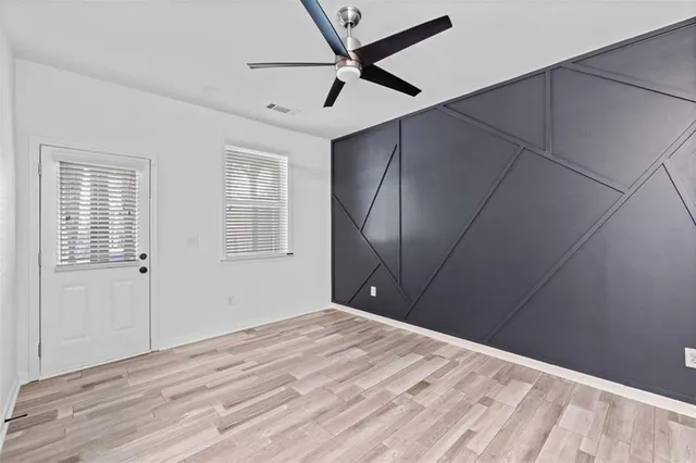 a view of a house with a yard and tree s