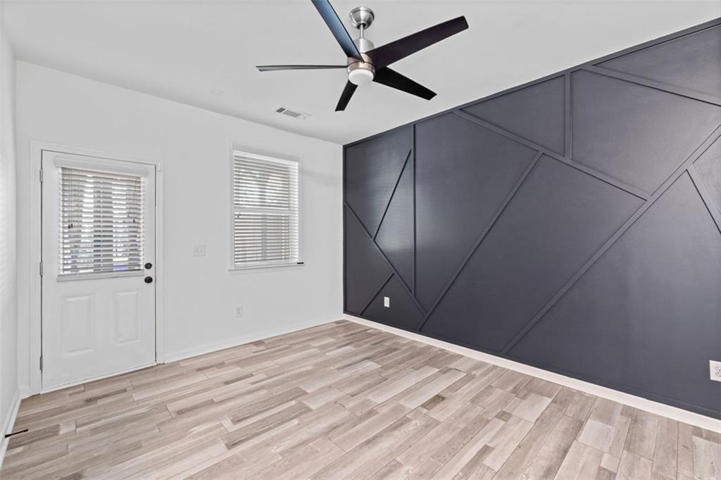 4228 Laurel Creek Court Southeast, Unit 6 Smyrna, GA 30080 - Photo 47 of 59 a view of a livingroom with a ceiling fan and wooden floor