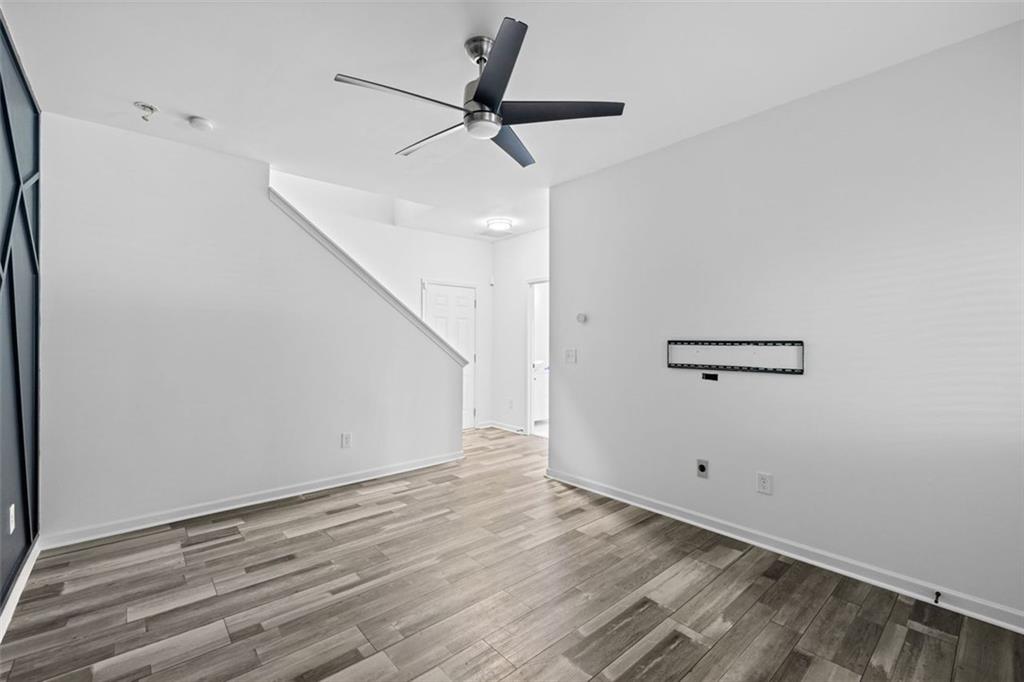 4228 Laurel Creek Court Southeast, Unit 6 Smyrna, GA 30080 - Photo 49 of 59 a view of a room with wooden floor and white walls