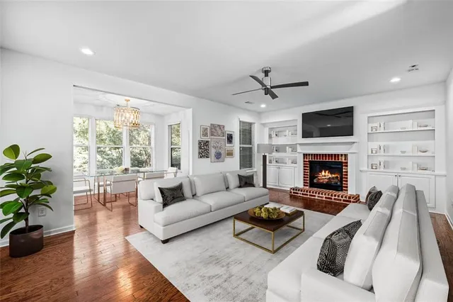 a living room with furniture fireplace and a flat screen tv