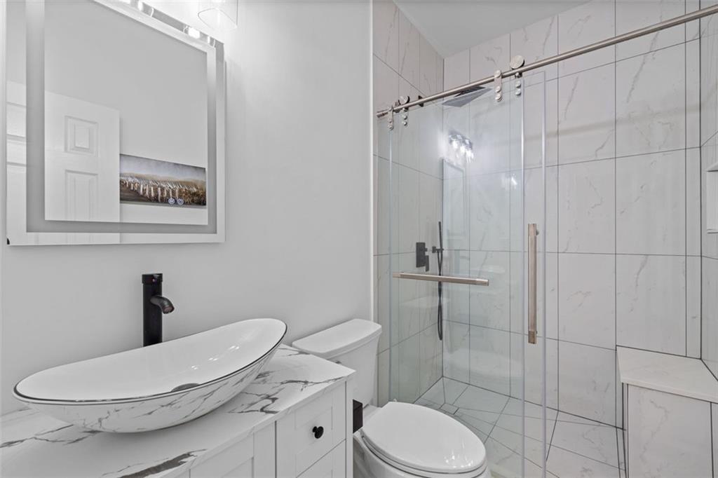 4228 Laurel Creek Court Southeast, Unit 6 Smyrna, GA 30080 - Photo 52 of 59 a bathroom with a toilet and a shower