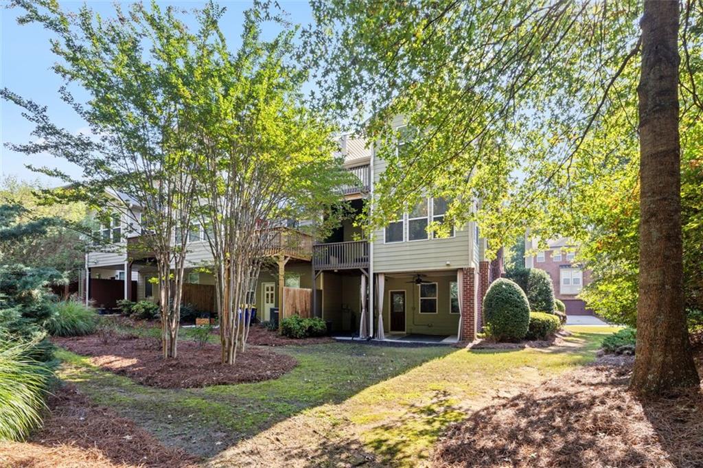 4228 Laurel Creek Court Southeast, Unit 6 Smyrna, GA 30080 - Photo 54 of 59 a view of a house with a yard and large tree