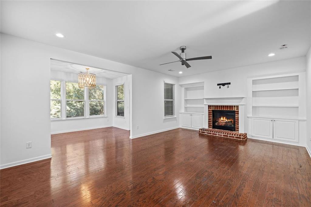 4228 Laurel Creek Court Southeast, Unit 6 Smyrna, GA 30080 - Photo 6 of 59 wooden floor in an empty room with a fireplace