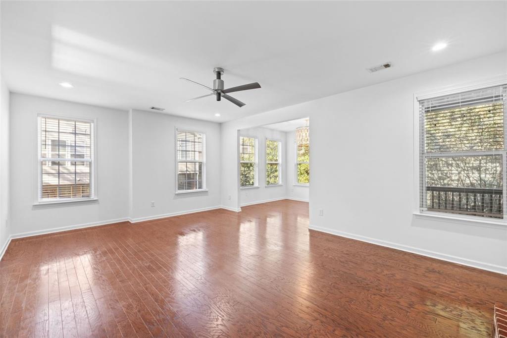 4228 Laurel Creek Court Southeast, Unit 6 Smyrna, GA 30080 - Photo 8 of 59 a view of an empty room with wooden floor and a window