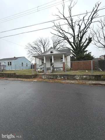 a front view of a house with a road