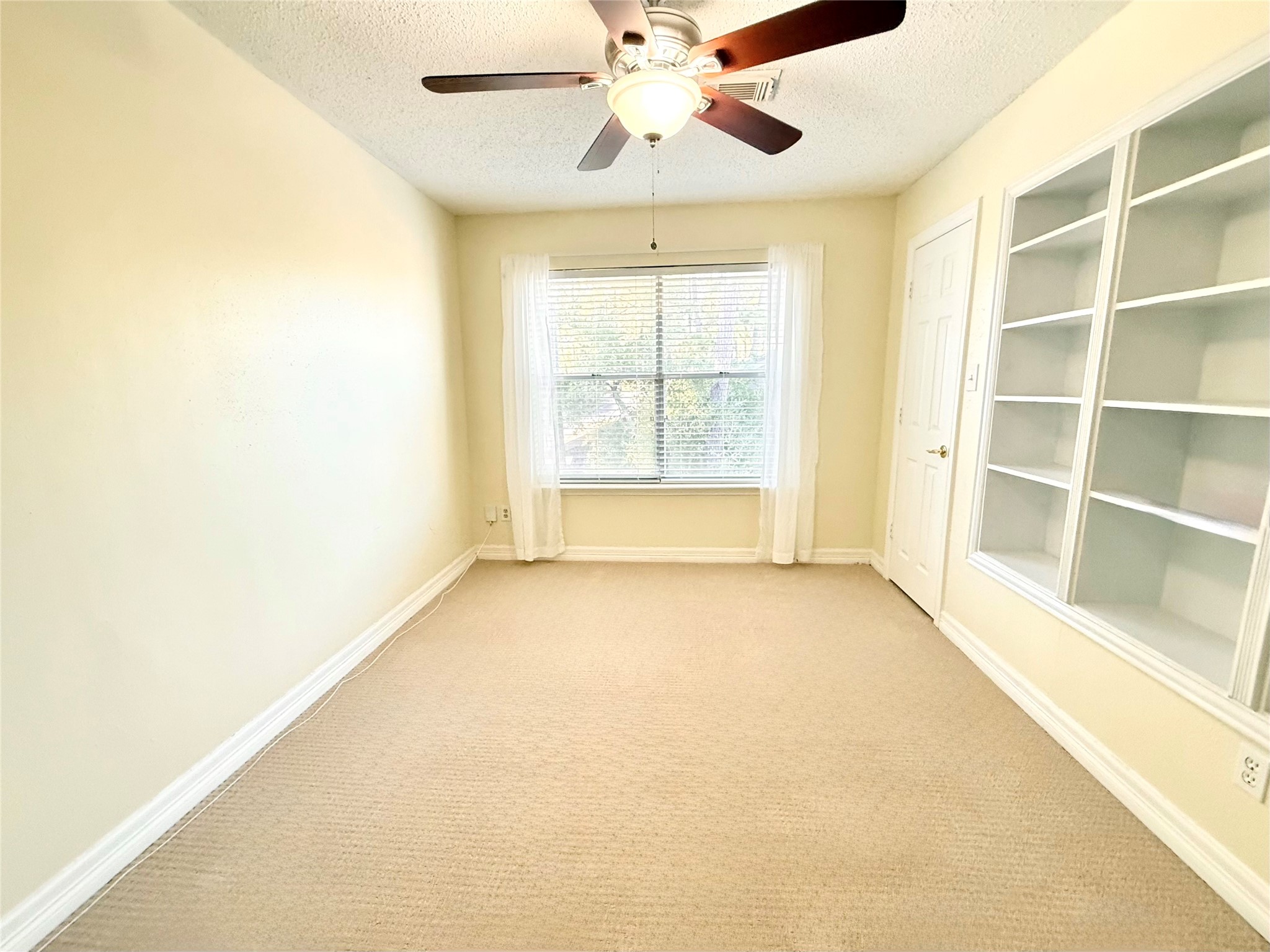 16902 Colony Creek Drive Spring, TX 77379 - Photo 14 of 18 a view of an empty room with a window
