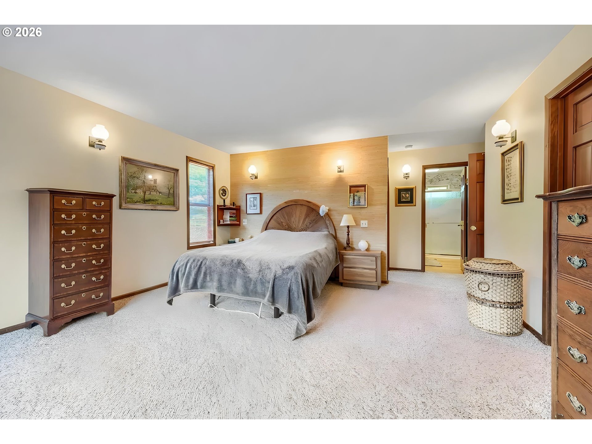 45354 Northwest Hartwick Road Banks, OR 97106 - Photo 15 of 35 a spacious bedroom with a bed and a walk in closet