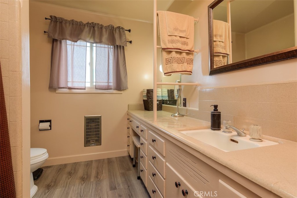 23256 Richfield Road Corning, CA 96021 - Photo 20 of 60 a bathroom with a sink a toilet and shower