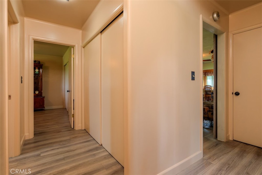 23256 Richfield Road Corning, CA 96021 - Photo 23 of 60 a view of a hallway with wooden floor and staircase