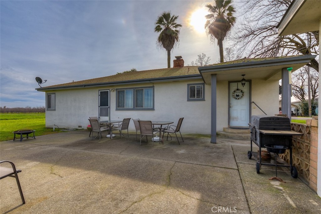 23256 Richfield Road Corning, CA 96021 - Photo 27 of 60 a view of a chairs and tables in the back yard of the house