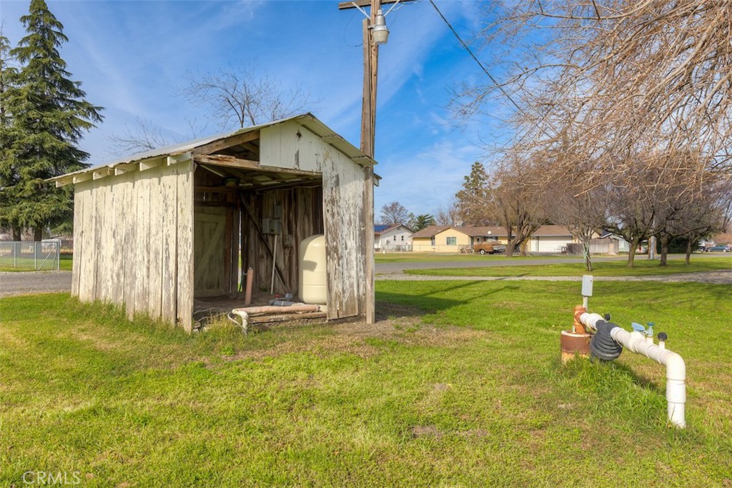 23256 Richfield Road Corning, CA 96021 - Photo 47 of 60 a front view of a house with garden