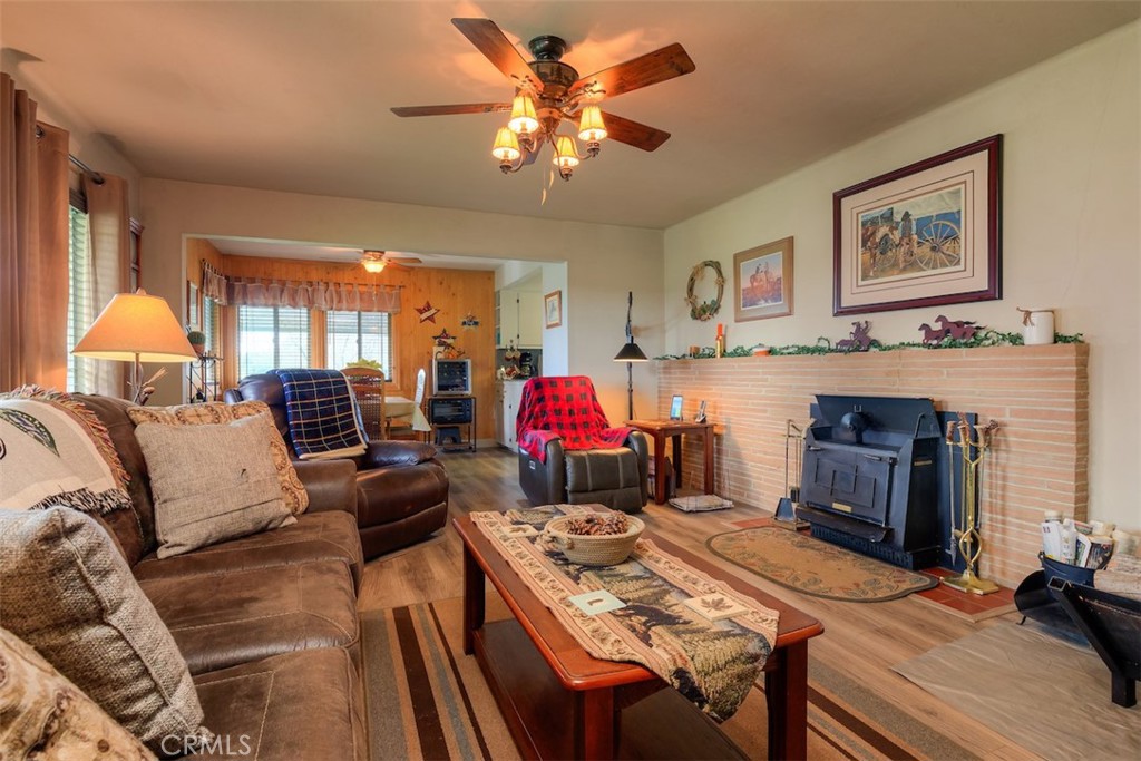 23256 Richfield Road Corning, CA 96021 - Photo 6 of 60 a living room with furniture and a fireplace