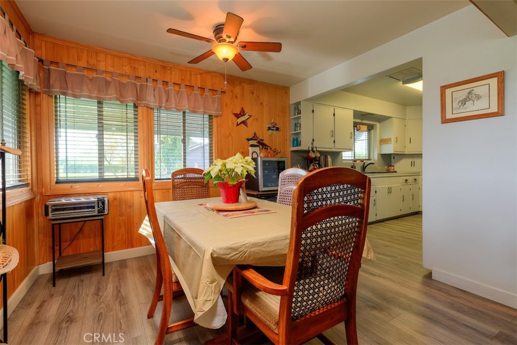 23256 Richfield Road Corning, CA 96021 - Photo 8 of 60 a view of a dining room with furniture window and wooden floor