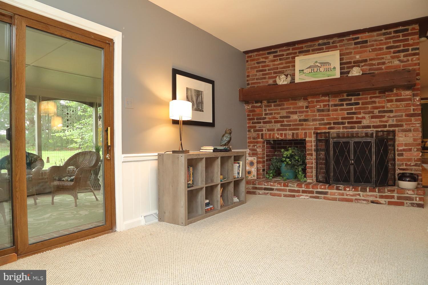 235 St Thomas Road Lancaster, PA 17601 - Photo 18 of 32 a view of an empty room with a fireplace and a window