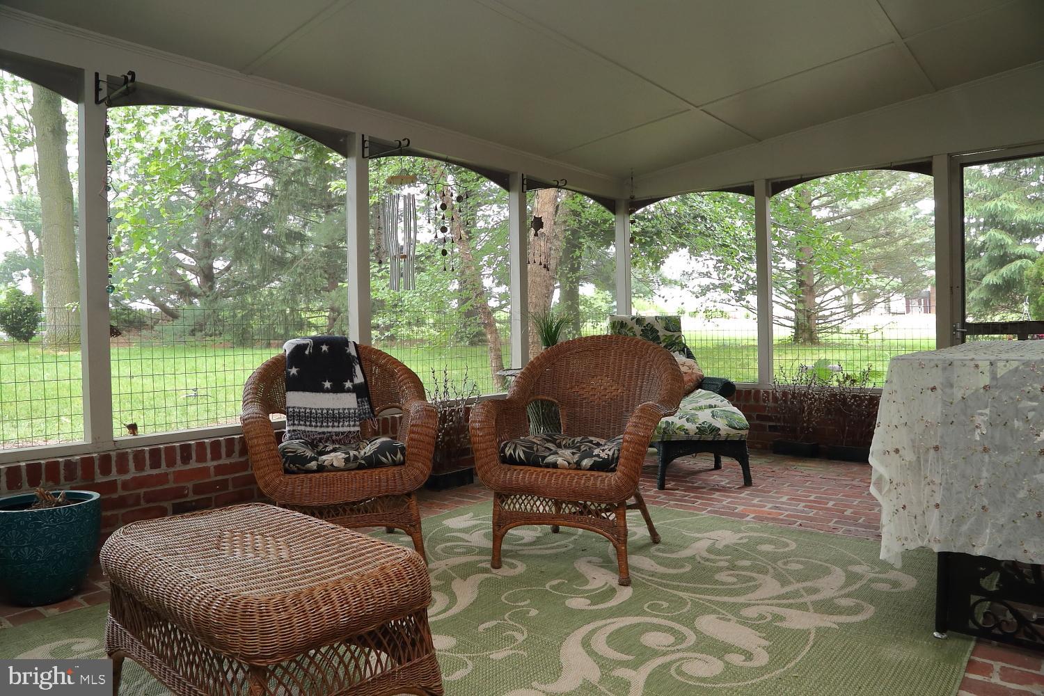 235 St Thomas Road Lancaster, PA 17601 - Photo 21 of 32 a living room with furniture and a floor to ceiling window