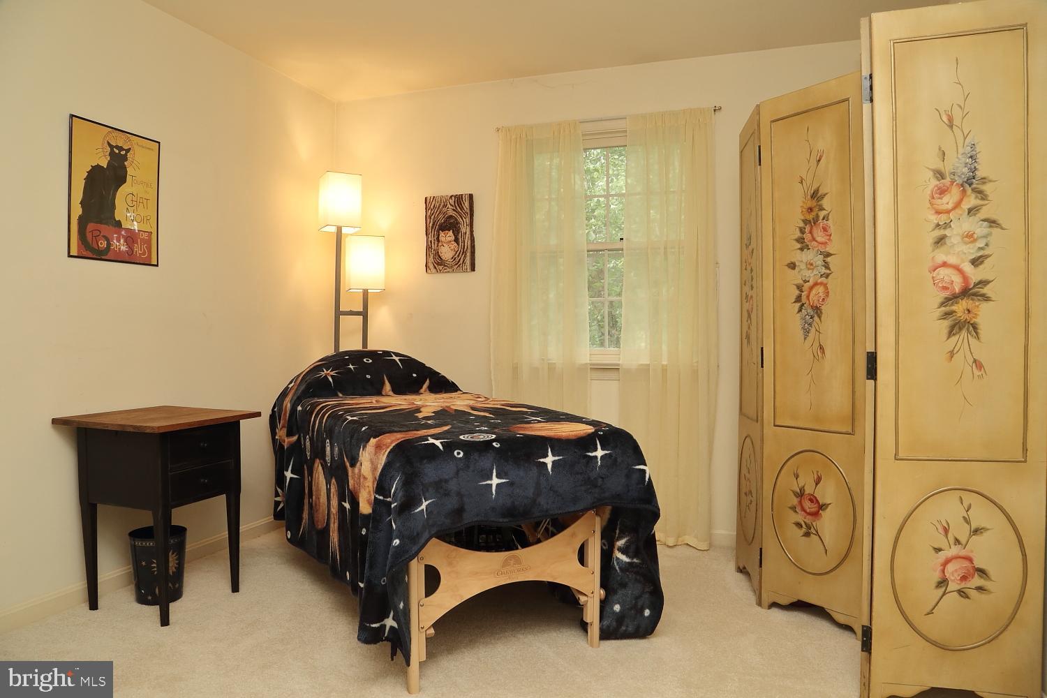 235 St Thomas Road Lancaster, PA 17601 - Photo 30 of 32 a bedroom with a bed and a table in it