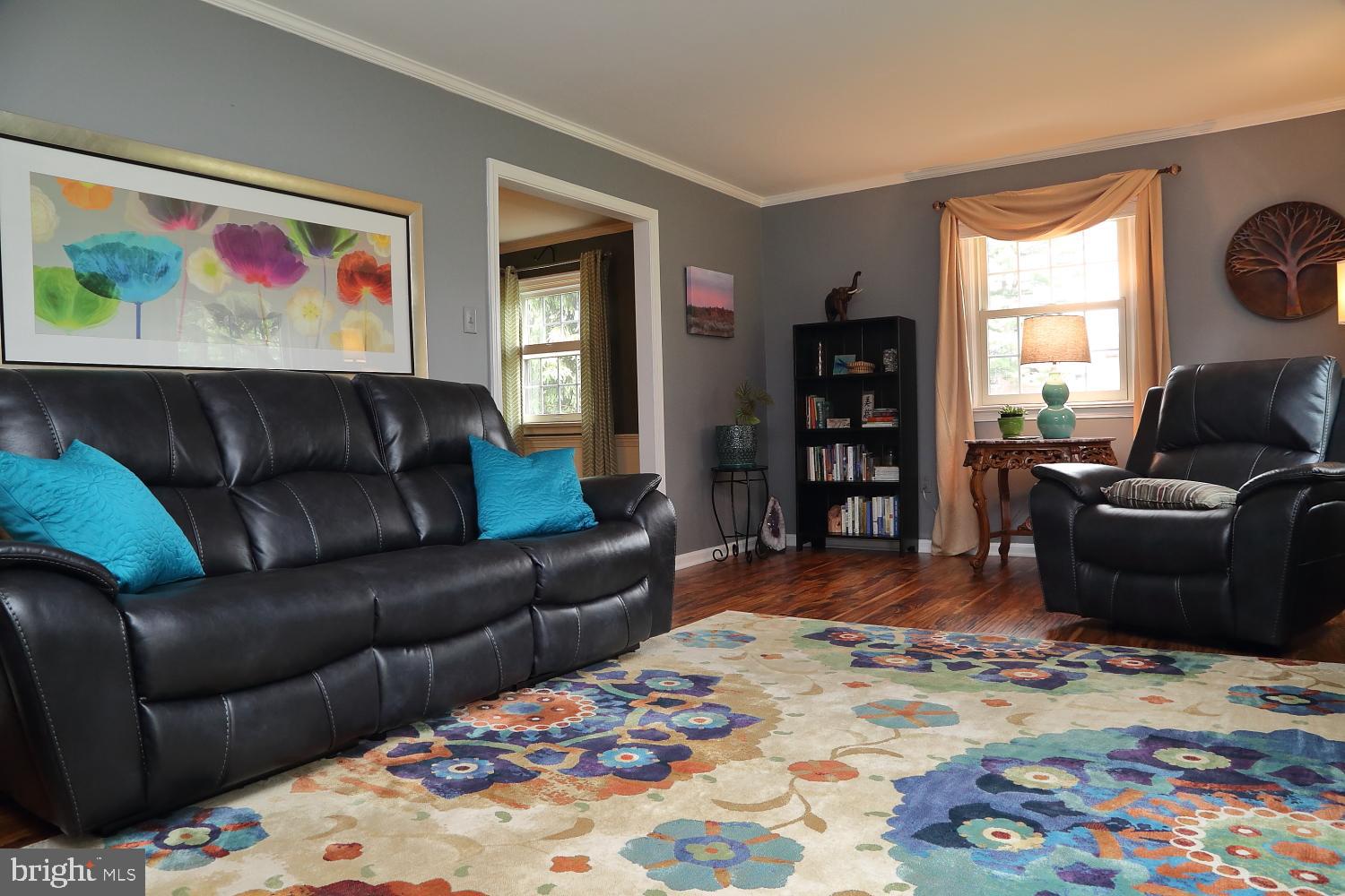 235 St Thomas Road Lancaster, PA 17601 - Photo 6 of 32 a living room with furniture or couch and a bookshelf