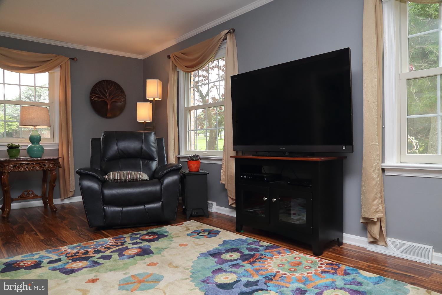 235 St Thomas Road Lancaster, PA 17601 - Photo 7 of 32 a living room with furniture and a flat screen tv