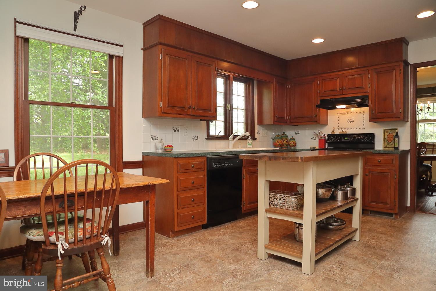 235 St Thomas Road Lancaster, PA 17601 - Photo 10 of 32 a kitchen with a stove a sink and a refrigerator