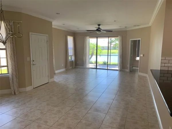 a view of a livingroom with wooden floor and a window