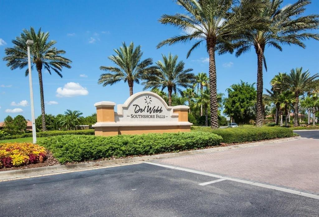 5409 Sunset Falls Drive Apollo Beach, FL 33572 - Photo 24 of 46 a sign board with a small yard and palm trees