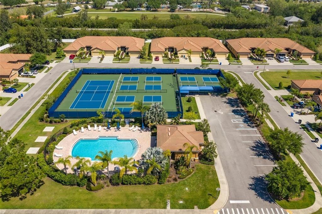 5409 Sunset Falls Drive Apollo Beach, FL 33572 - Photo 32 of 46 an aerial view of a house with a garden and lake view