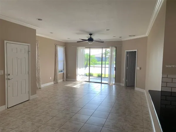 a view of an empty room with a window