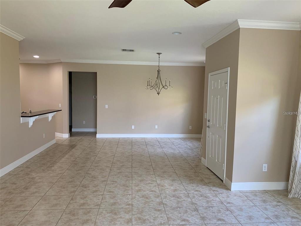 5409 Sunset Falls Drive Apollo Beach, FL 33572 - Photo 10 of 46 a view of a big room with wooden cabinet and windows