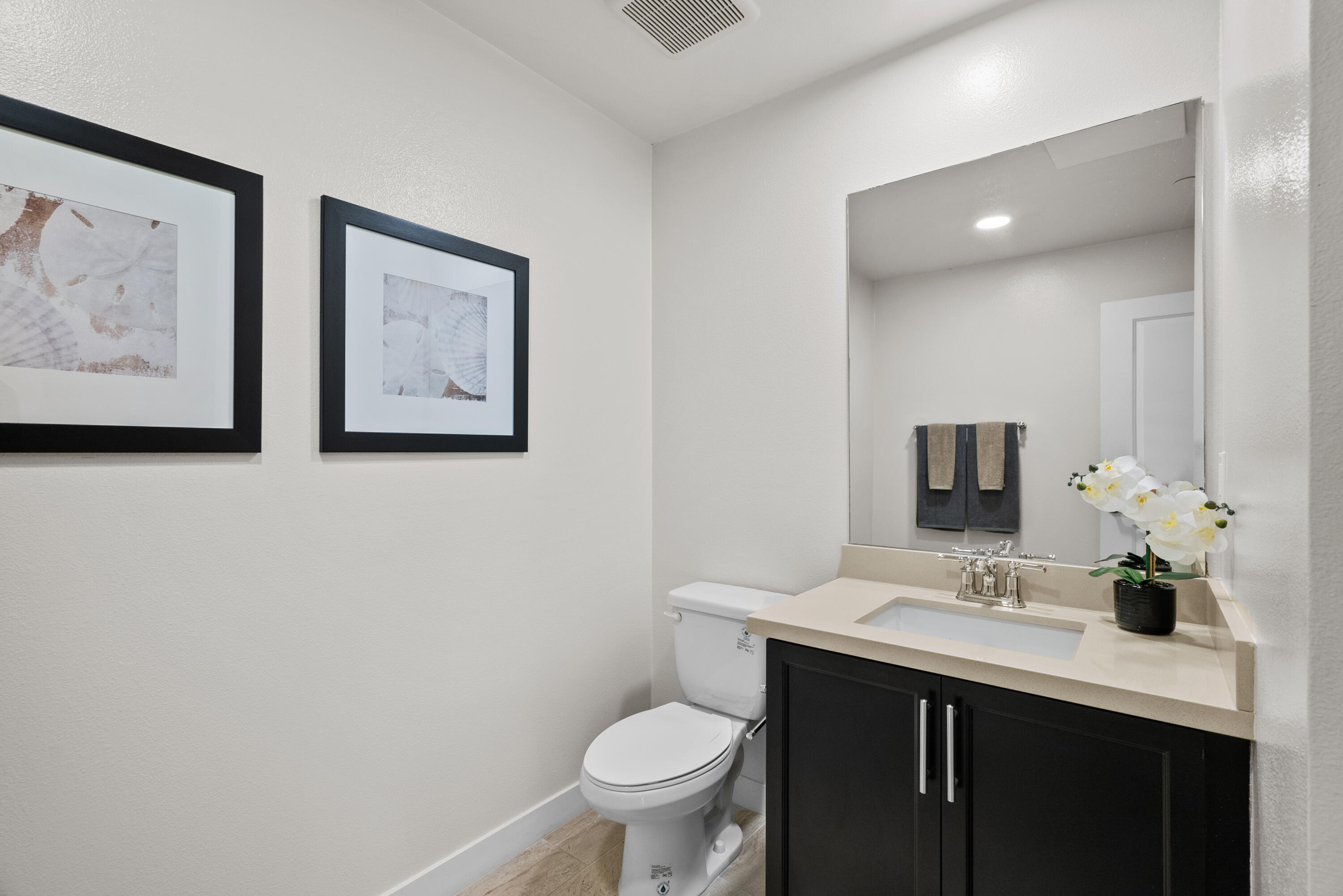 2840 Wagon Wheel Road, Unit 403 Oxnard, CA 93036 - Photo 20 of 23 a bathroom with a toilet sink and mirror