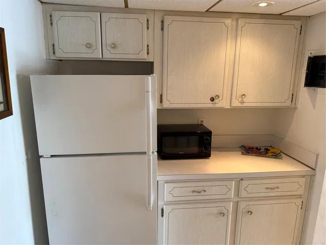a view of a storage and utility room with washer and dryer