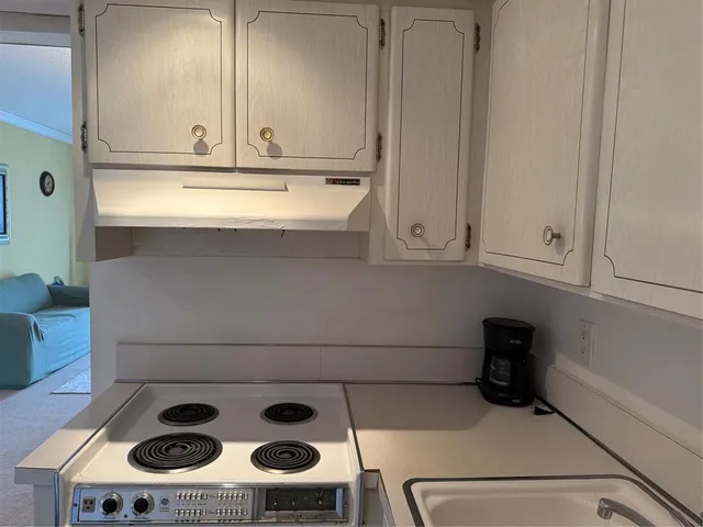 a kitchen with a stove and a microwave