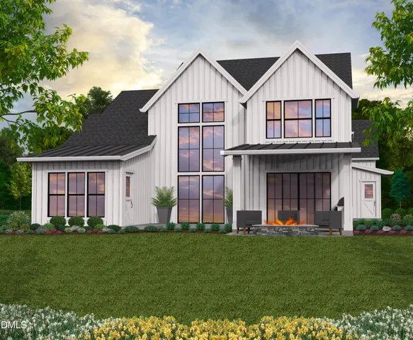 a front view of a house with a garden and plants