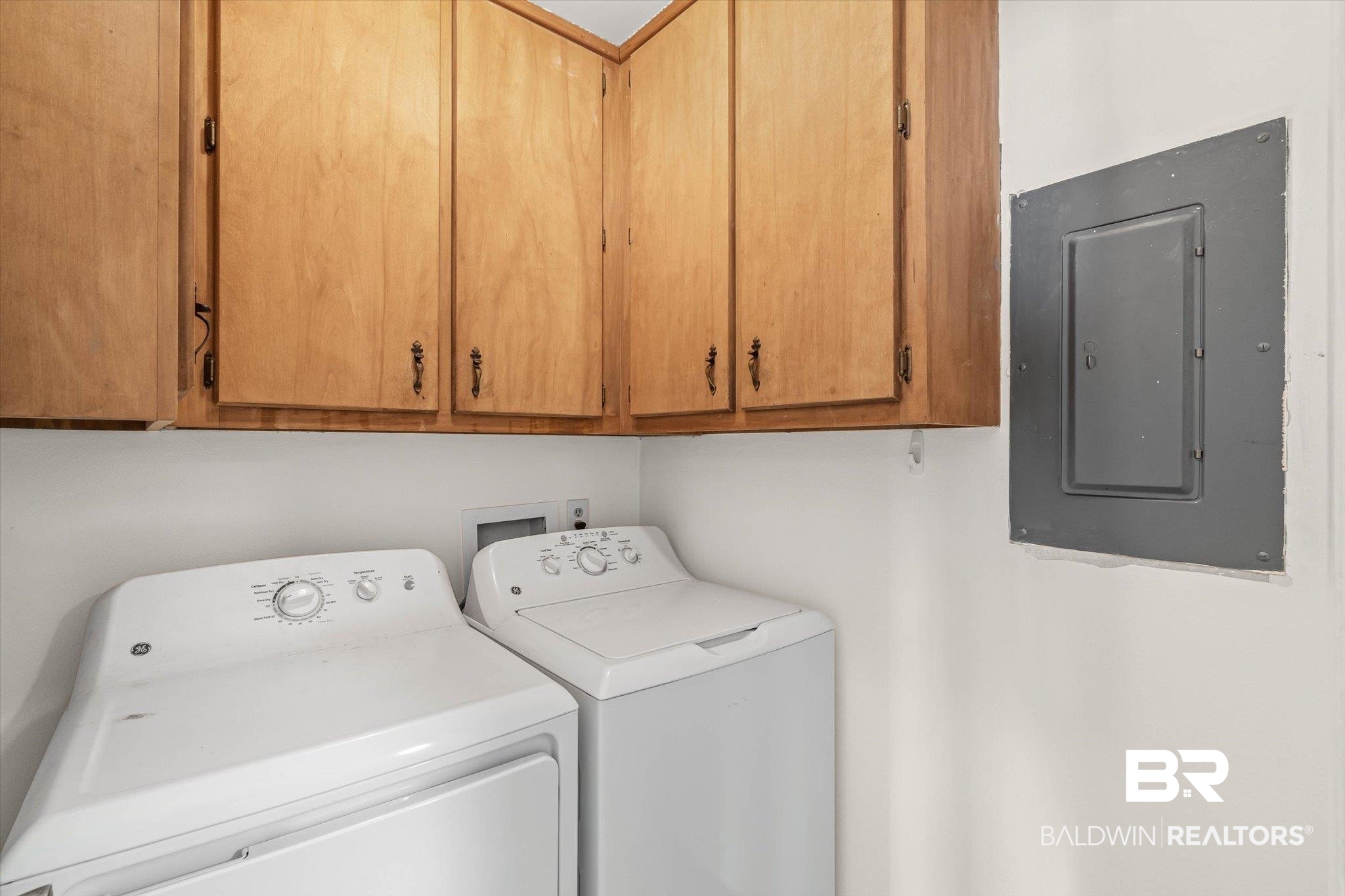 5900 Grelot Road, Unit 504 Mobile, AL 36609 - Photo 10 of 24 Laundry area featuring electric panel, separate washer and dryer, and cabinet space