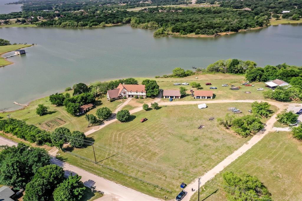 an aerial view of a house with a lake view
