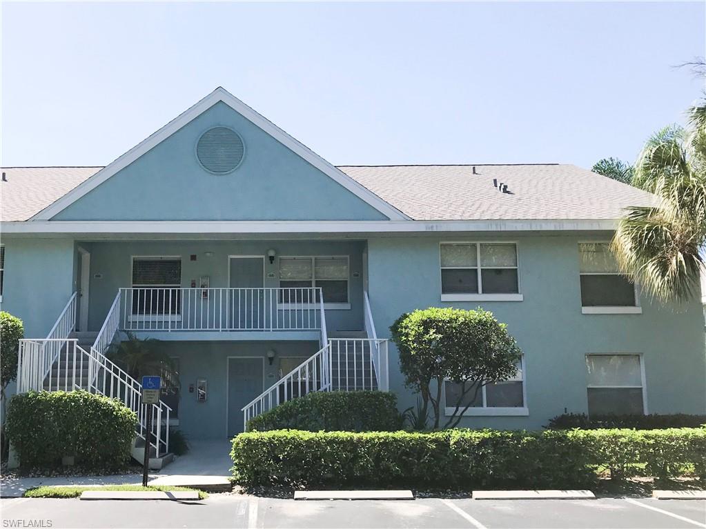 157 Wading Bird Circle, Unit K205 Naples, FL 34110 - Photo 19 of 22 a front view of a house with garden