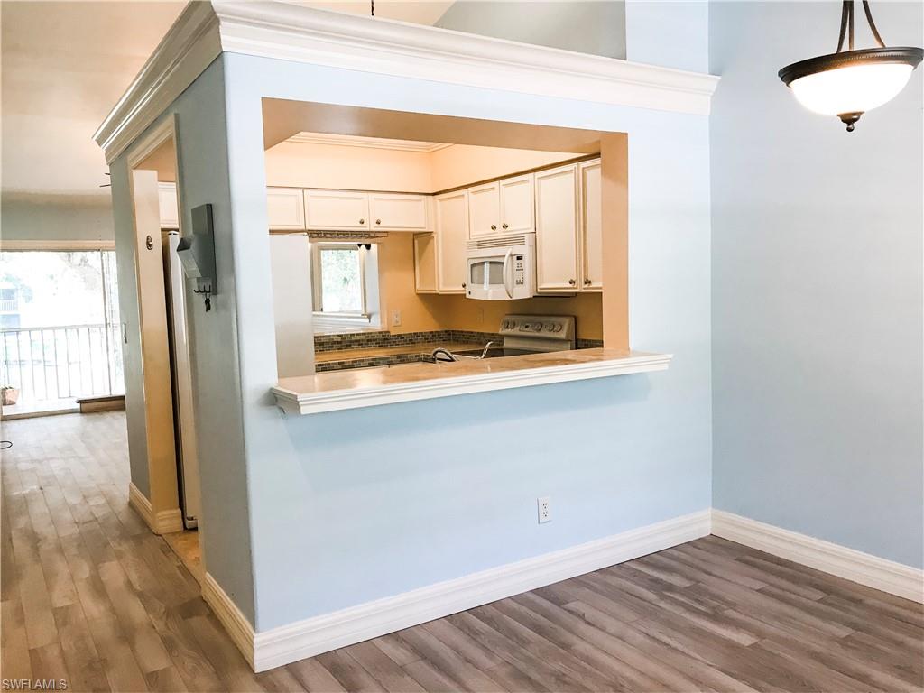 157 Wading Bird Circle, Unit K205 Naples, FL 34110 - Photo 9 of 22 a view of front door and bedroom