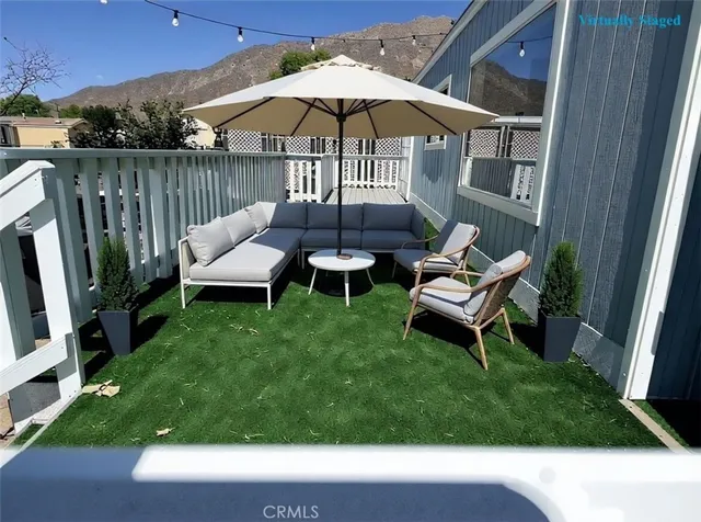 a view of a patio with furniture and backyard