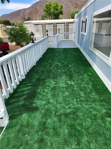 a view of a house with backyard and porch