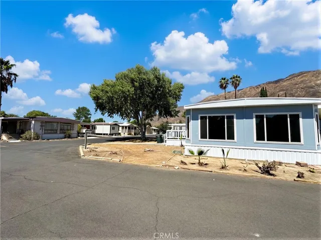 a swimming pool with an outdoor space and seating area